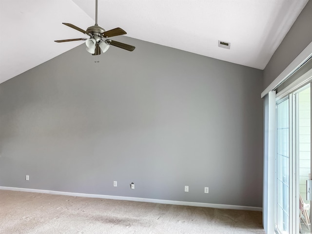 empty room with carpet flooring, ceiling fan, and vaulted ceiling