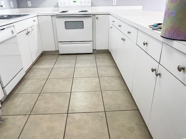 kitchen featuring sink, white cabinetry, white appliances, and light tile flooring