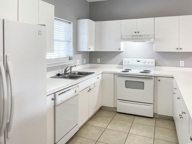 kitchen featuring white appliances, sink, white cabinets, and light tile flooring