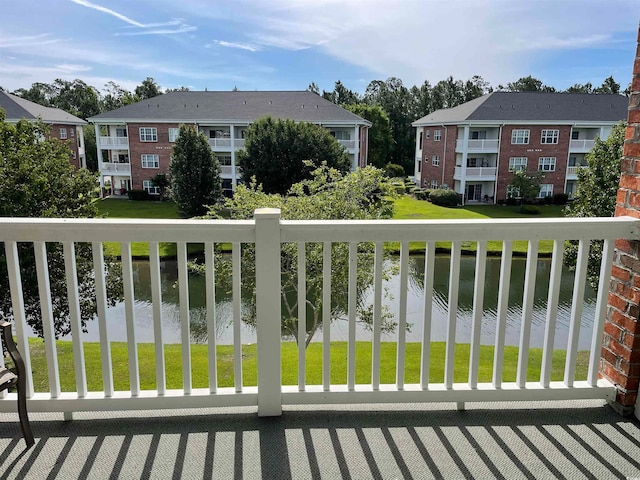 balcony featuring a water view