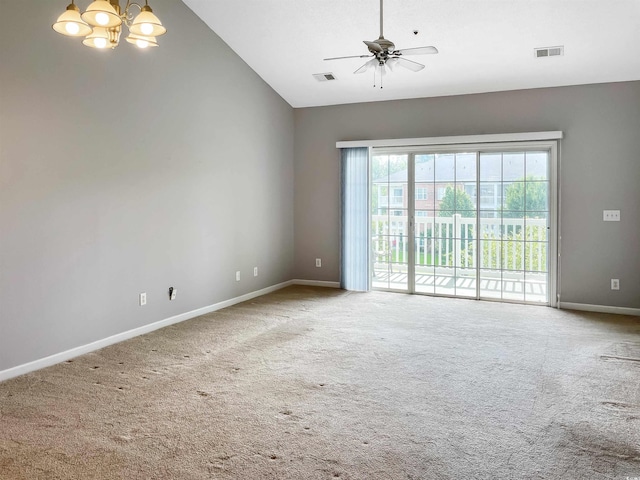 unfurnished room featuring carpet floors, vaulted ceiling, and ceiling fan with notable chandelier