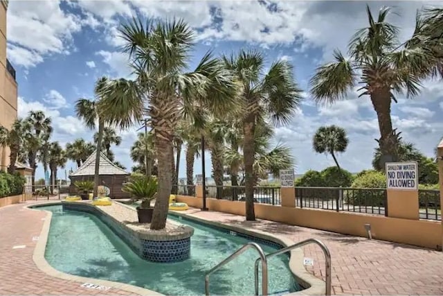 view of pool featuring a patio area