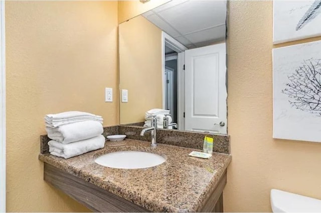 bathroom featuring oversized vanity and toilet