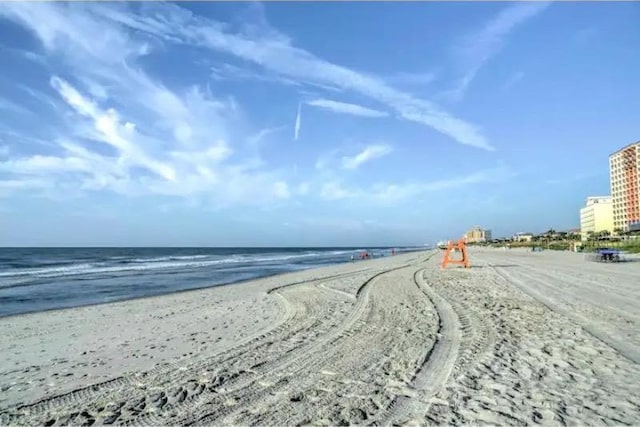 view of water feature with a beach view