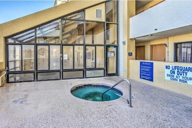 view of pool featuring a community hot tub