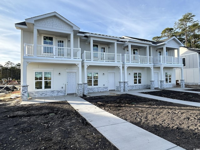 view of front of house with a balcony