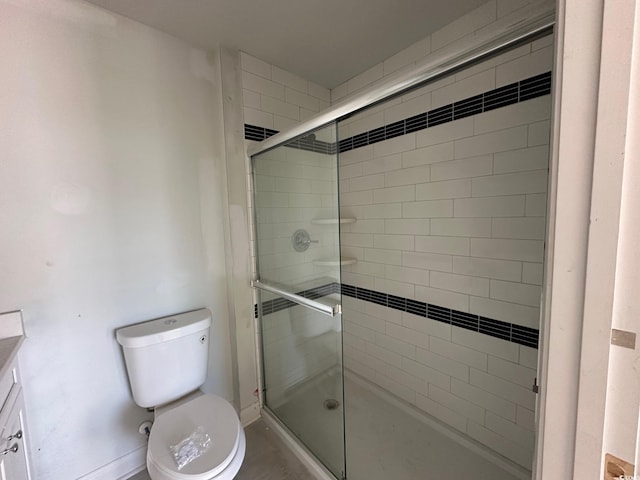 bathroom with vanity, toilet, and walk in shower