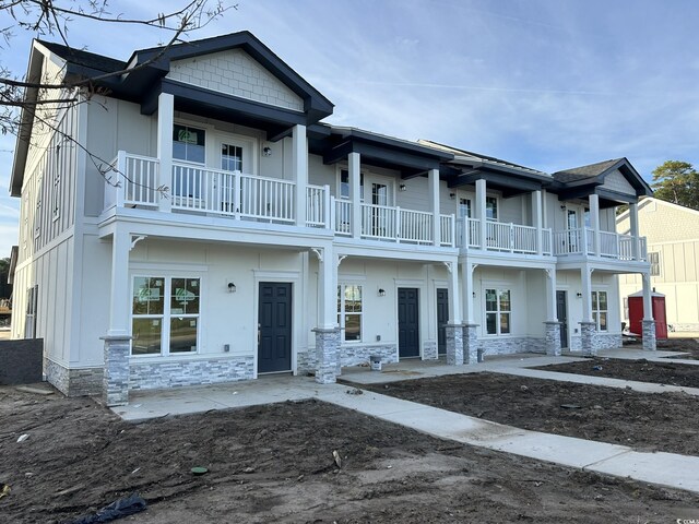 view of front of house with a balcony