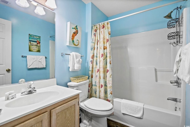 full bathroom with toilet, vanity, and shower / bath combo