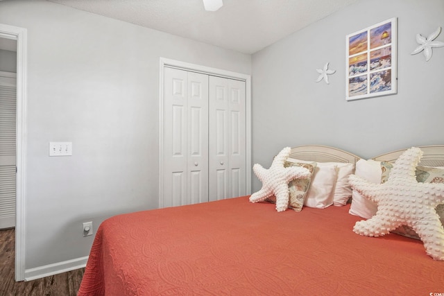 bedroom featuring a closet and dark hardwood / wood-style flooring