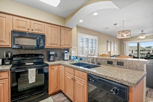 kitchen featuring ceiling fan, sink, tasteful backsplash, and black appliances