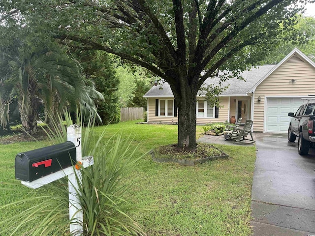 ranch-style home featuring a front yard and a garage