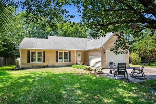 ranch-style house with a front yard and a garage