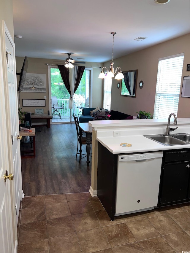 kitchen featuring sink, decorative light fixtures, ceiling fan with notable chandelier, and dishwasher