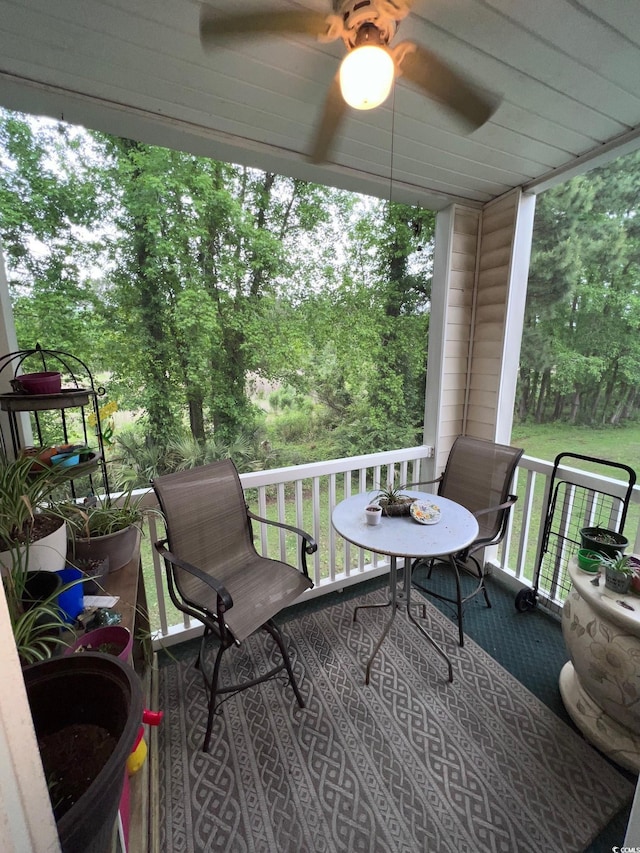 wooden terrace with ceiling fan