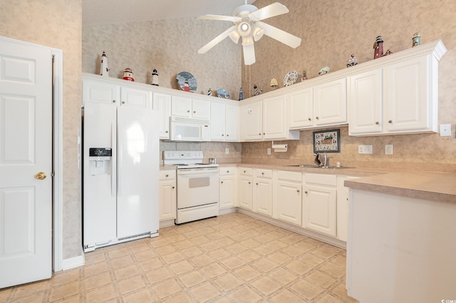 kitchen featuring backsplash, ceiling fan, white cabinets, sink, and white appliances