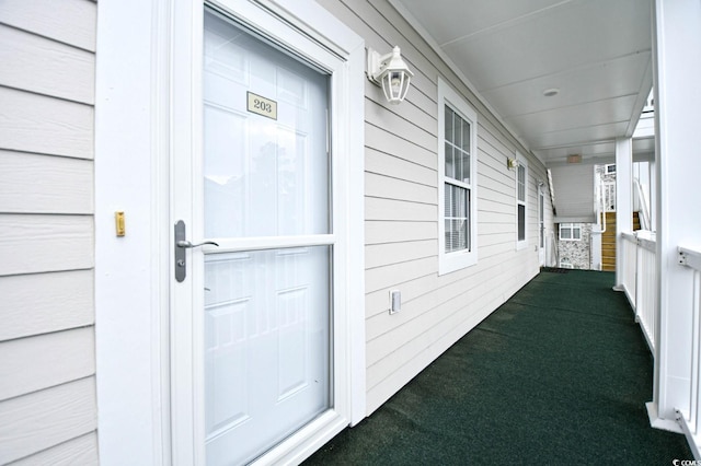 property entrance featuring covered porch