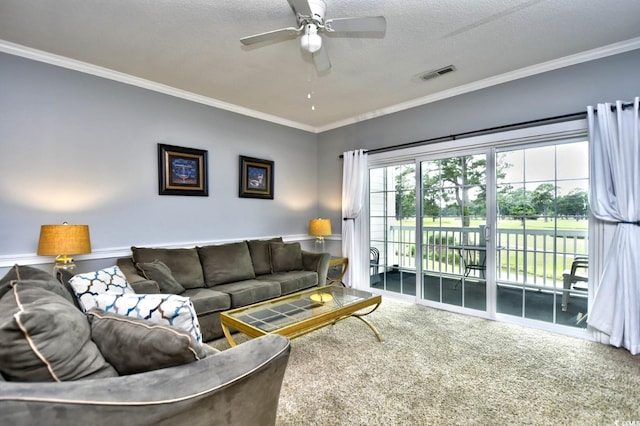 carpeted living room with a textured ceiling, ceiling fan, and crown molding