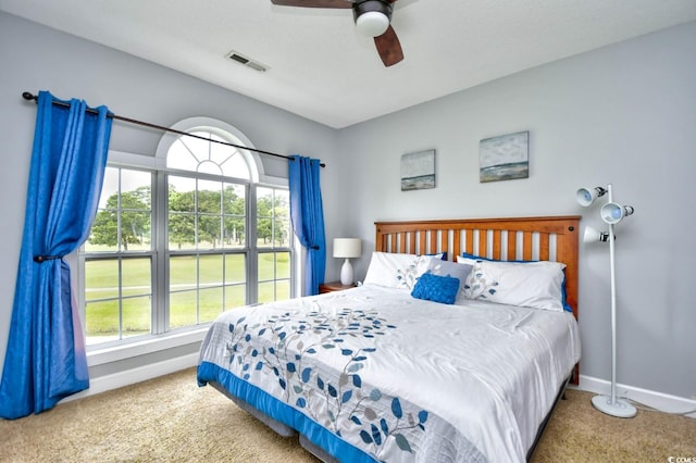 carpeted bedroom with ceiling fan