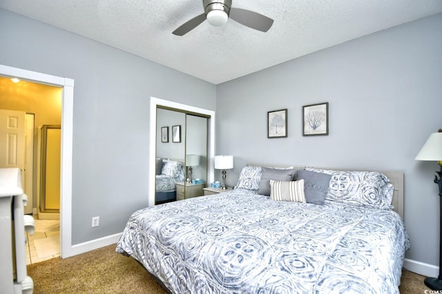 carpeted bedroom featuring a textured ceiling, a closet, and ceiling fan