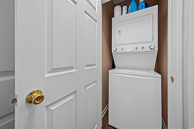 laundry room featuring stacked washer and clothes dryer