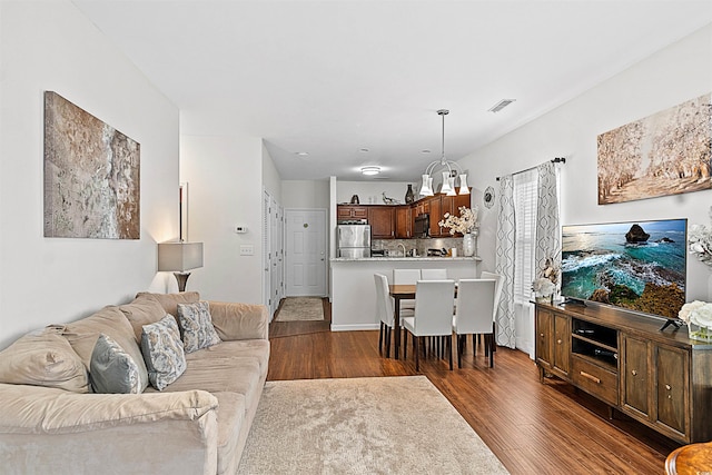 living room featuring dark wood-type flooring