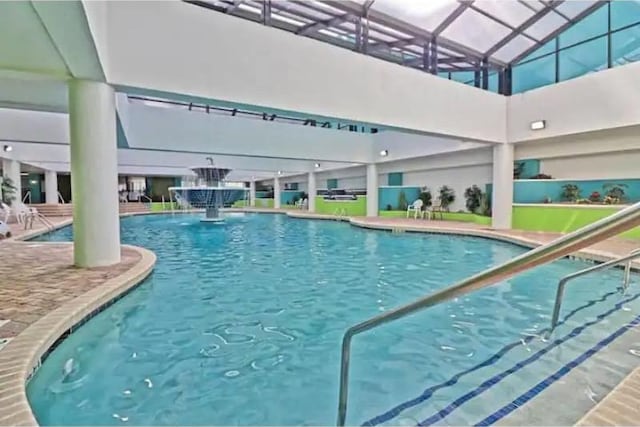 view of pool with pool water feature