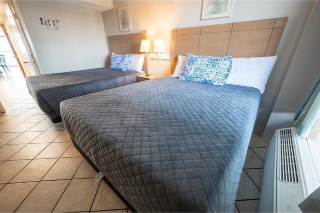 bedroom with light tile patterned floors