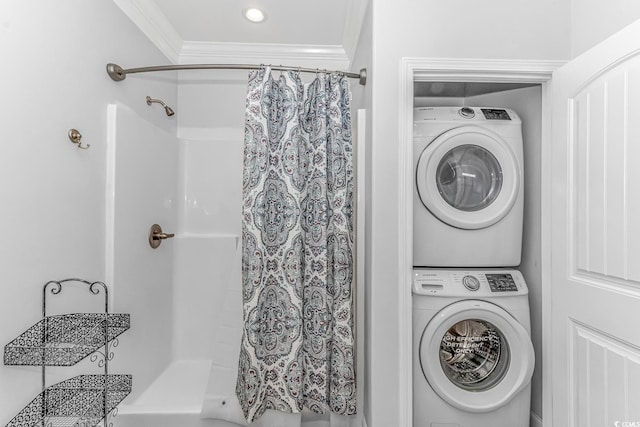 washroom featuring crown molding and stacked washer / drying machine