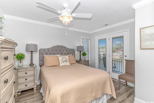 bedroom featuring ceiling fan, light hardwood / wood-style flooring, crown molding, and access to outside