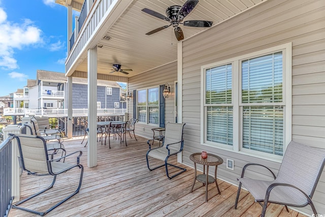 wooden deck with ceiling fan