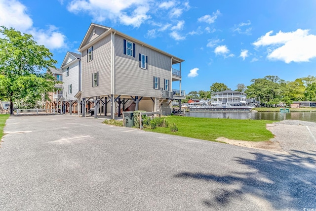 rear view of property featuring a water view