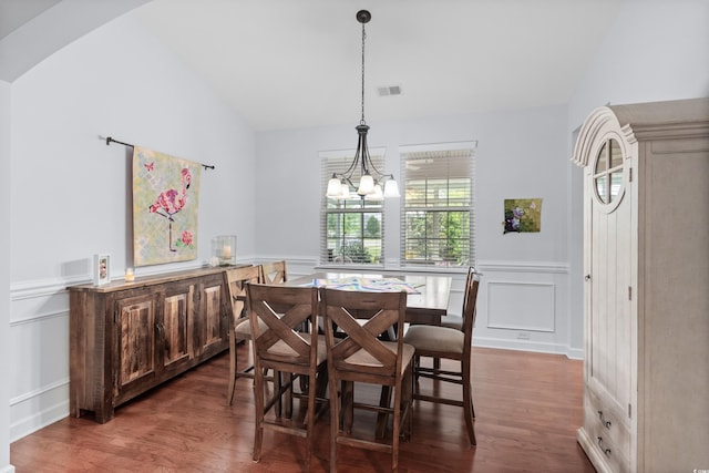 1433 Beaumont Way, Myrtle Beach, SC 29577 - dining room with lofted ceiling, a decorative wall, wood finished floors, a chandelier, and a wainscoted wall