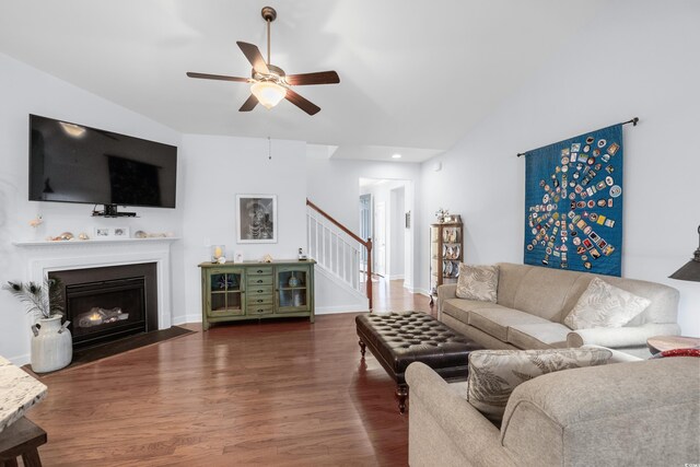 1433 Beaumont Way, Myrtle Beach, SC 29577 - living area featuring stairs, wood finished floors, a ceiling fan, a fireplace with flush hearth, and vaulted ceiling