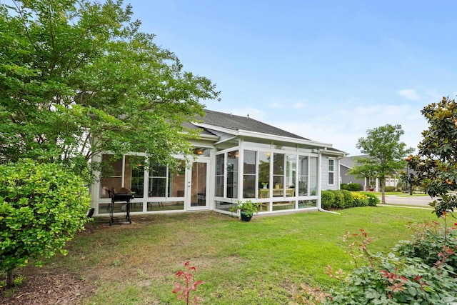 1433 Beaumont Way, Myrtle Beach, SC 29577 - rear view of property featuring a sunroom, a yard, and a shingled roof