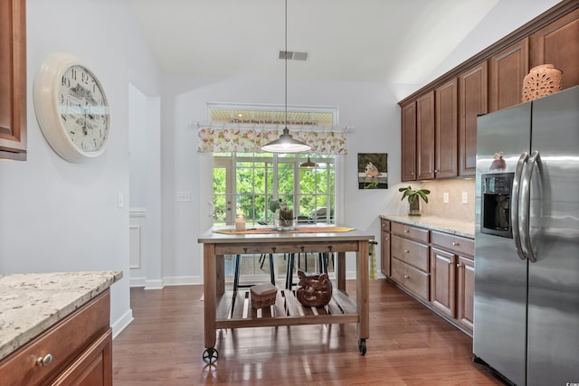 1433 Beaumont Way, Myrtle Beach, SC 29577 - kitchen with stainless steel refrigerator with ice dispenser, vaulted ceiling, dark wood-style flooring, light stone counters, and baseboards