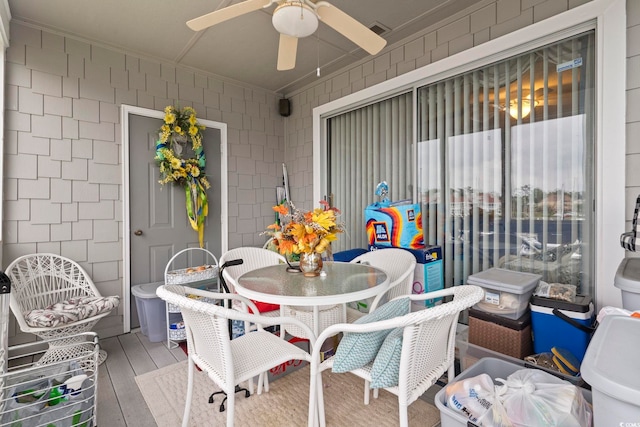 exterior space featuring visible vents, outdoor dining space, and ceiling fan