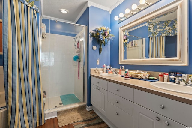 full bath with wood finished floors, ornamental molding, and a stall shower