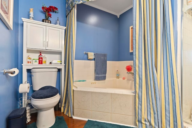 bathroom featuring toilet, hardwood / wood-style flooring, ornamental molding, and independent shower and bath