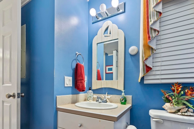 bathroom featuring vanity and toilet