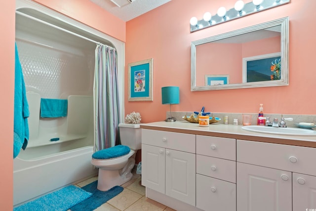 full bathroom with a textured ceiling, shower / bathtub combination with curtain, toilet, vanity, and tile patterned flooring