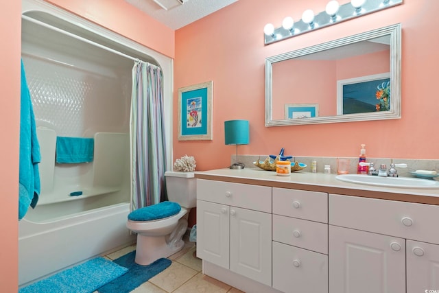 bathroom with vanity, tile patterned flooring, toilet, and shower / tub combo