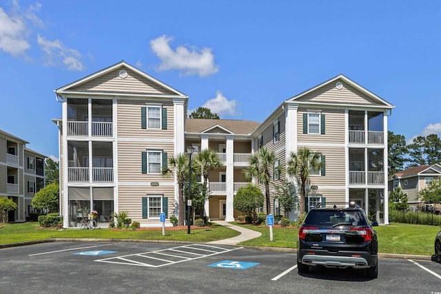 242 Sun Colony Blvd Unit 101, Longs, SC 29568 - view of property featuring uncovered parking