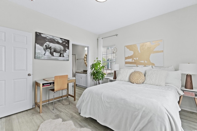 242 Sun Colony Blvd Unit 101, Longs, SC 29568 - bedroom featuring light wood-style floors and ensuite bathroom