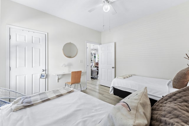 bedroom with ceiling fan and light wood-type flooring