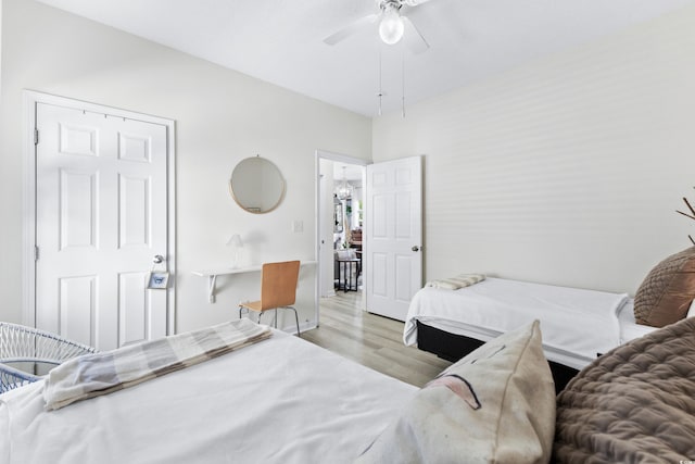 242 Sun Colony Blvd Unit 101, Longs, SC 29568 - bedroom with wood finished floors and ceiling fan