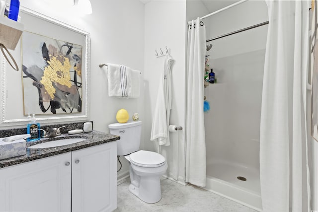 bathroom with vanity, toilet, and walk in shower