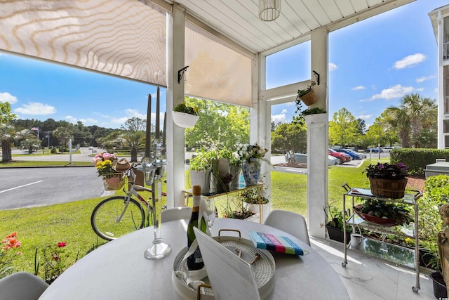 sunroom / solarium featuring plenty of natural light