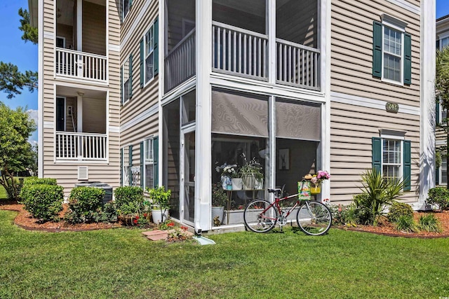 242 Sun Colony Blvd Unit 101, Longs, SC 29568 - view of side of home featuring a yard and a sunroom