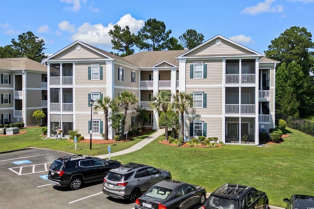 242 Sun Colony Blvd Unit 101, Longs, SC 29568 - view of building exterior featuring uncovered parking